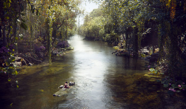 Mowgli and Baloo float down the river in The Jungle Book